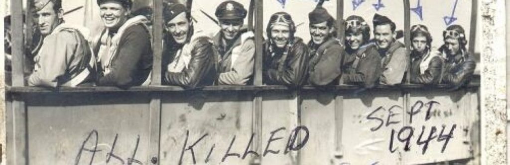 WWII pilot and crew above graffiti